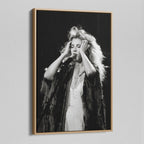 Angled view of the Stevie Nicks 1970s live black and white canvas in a natural oak floating frame