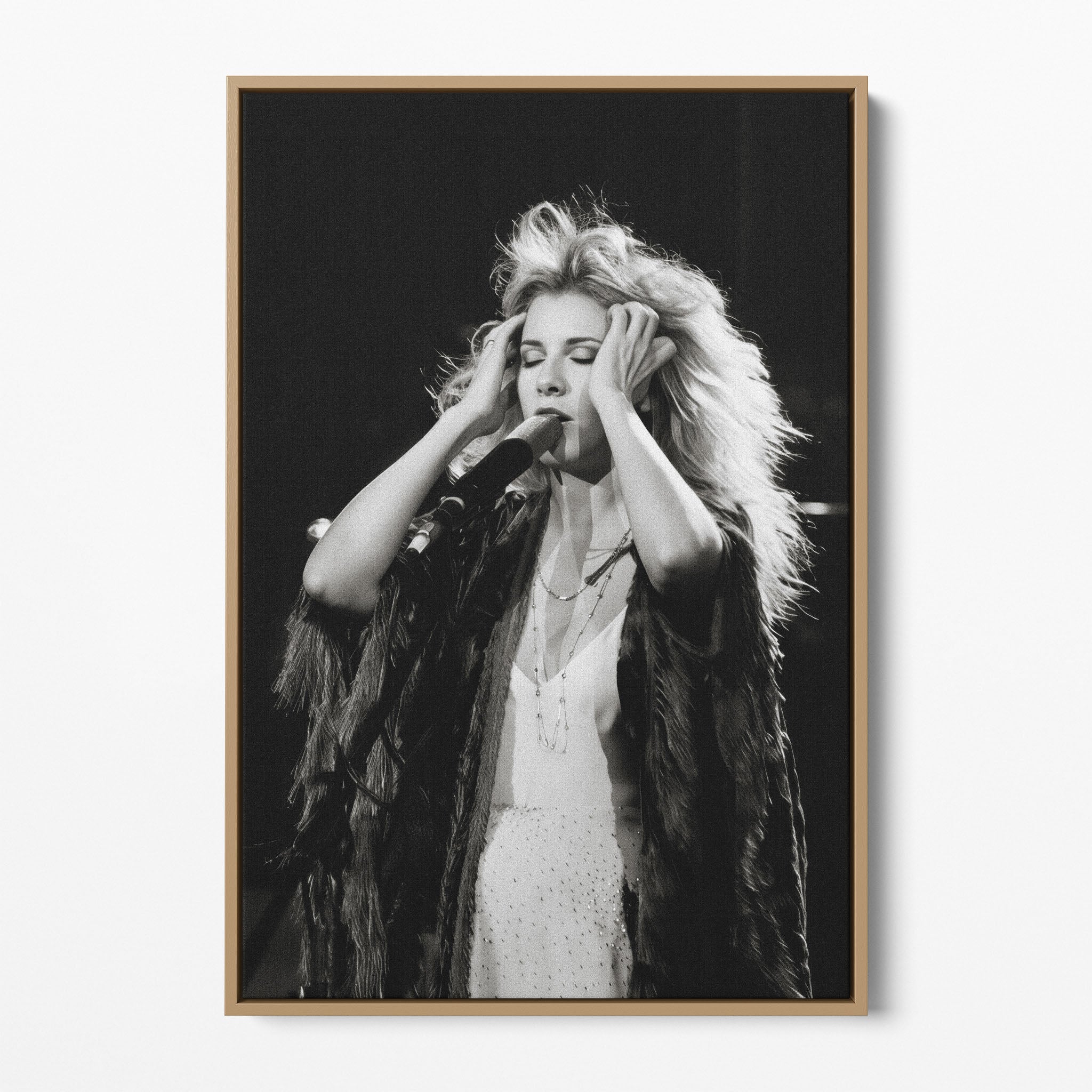 Front view of the Stevie Nicks 1970s live black and white canvas in a natural oak floating frame