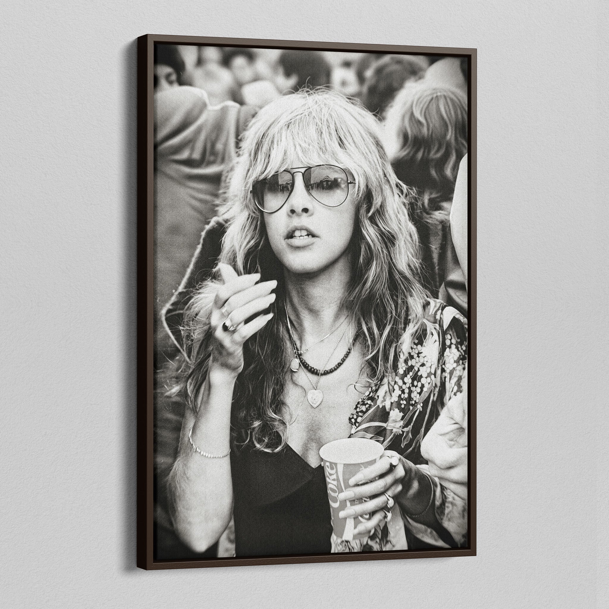 Angled view of the Stevie Nicks 1979 Tusk Tour black and white canvas in a dark walnut floating frame