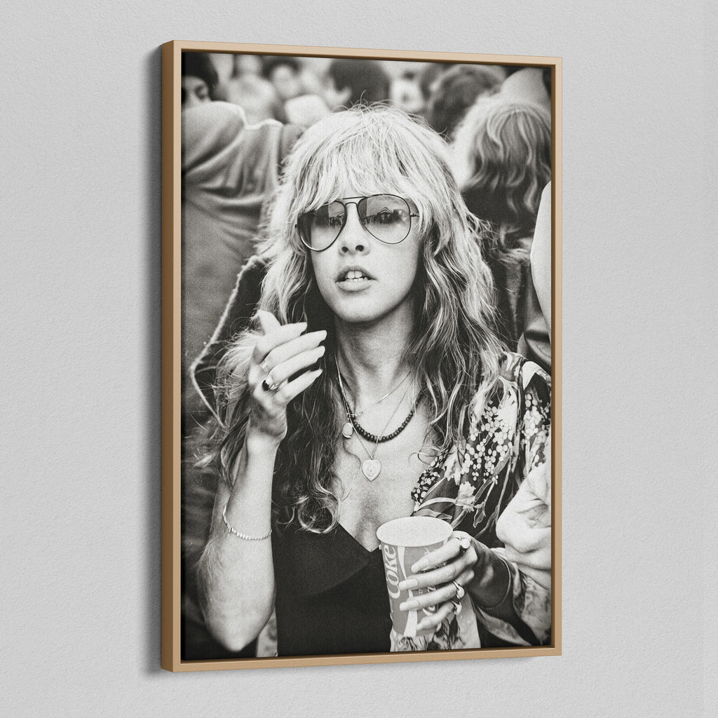 Angled view of the Stevie Nicks 1979 Tusk Tour black and white canvas in a natural oak floating frame