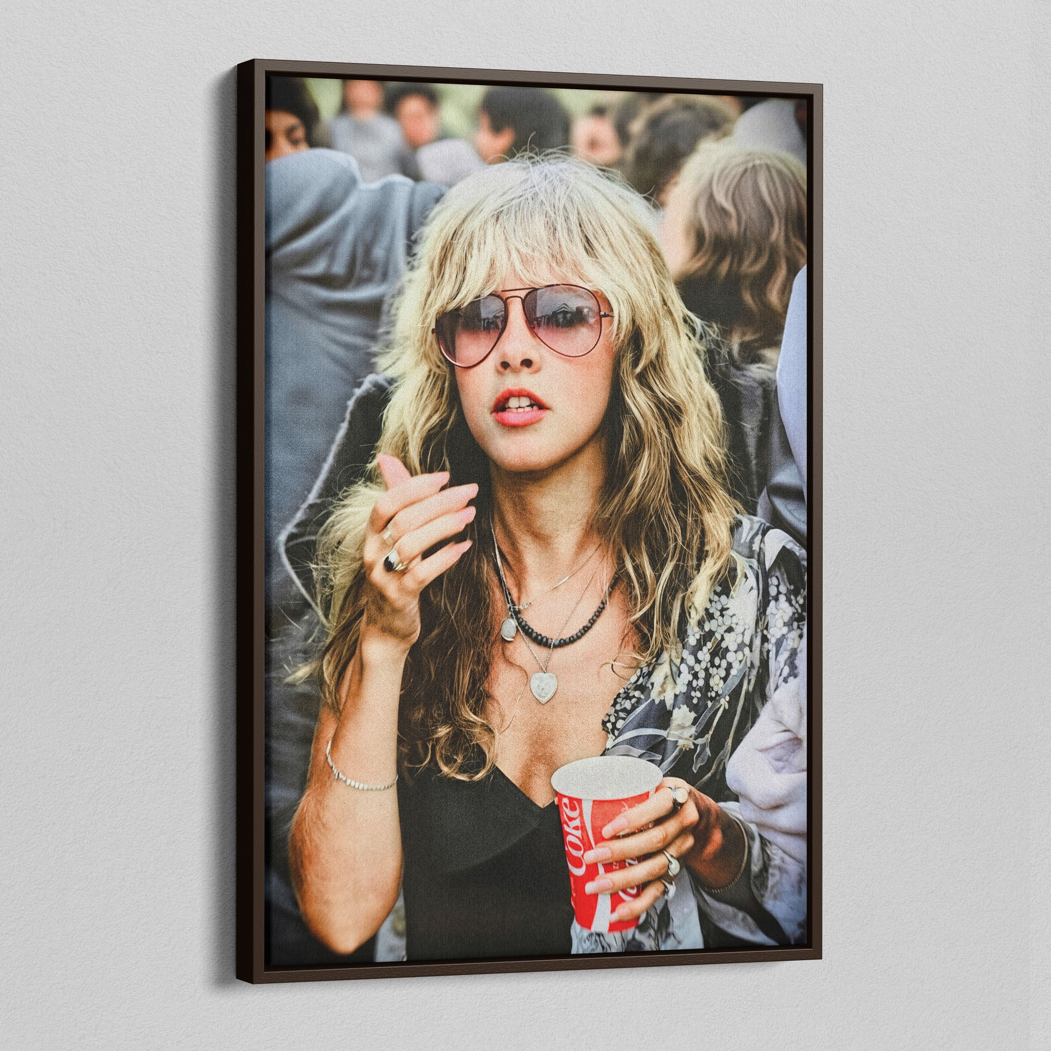 Angled view of the Stevie Nicks 1979 Tusk Tour colour canvas in a dark walnut floating frame