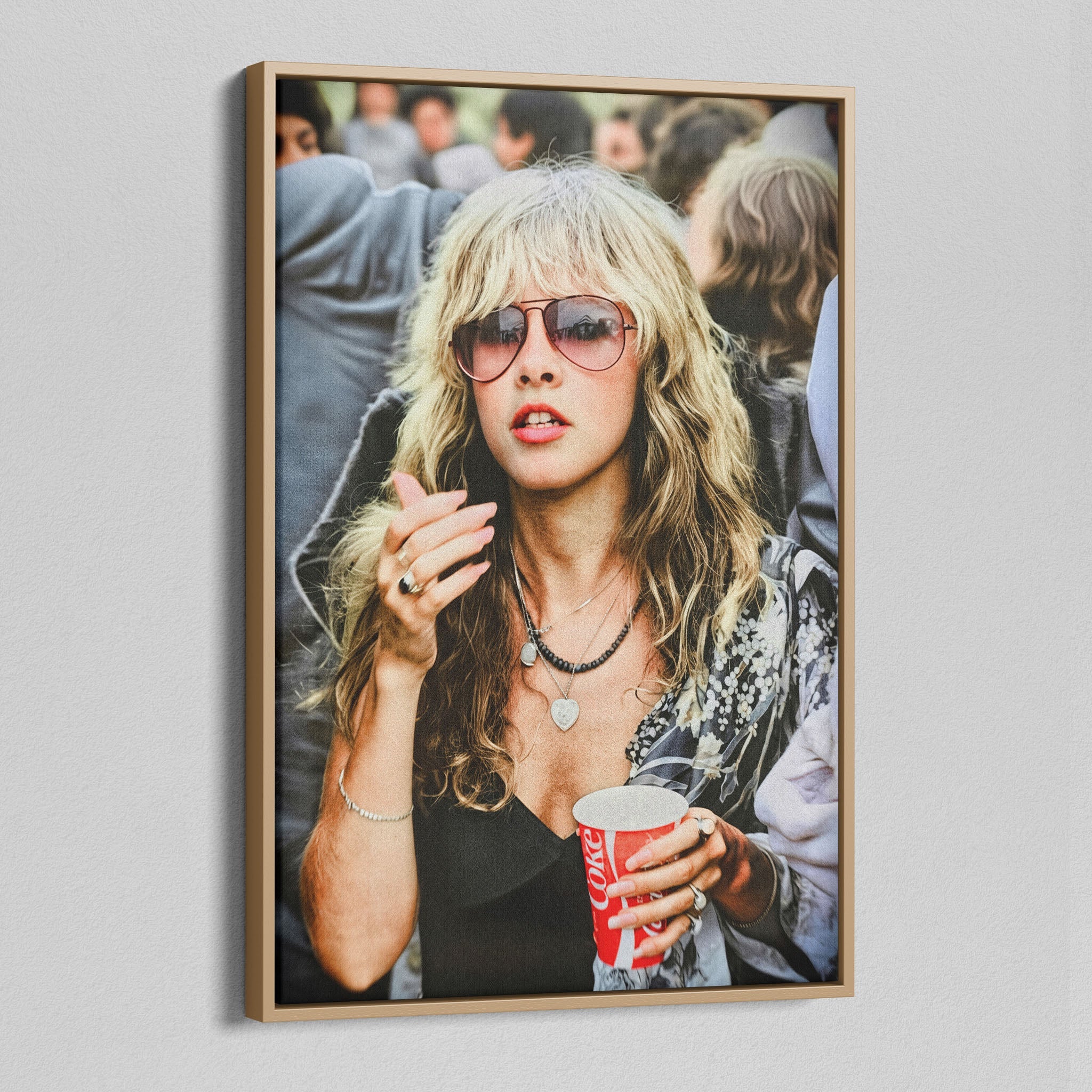 Angled view of the Stevie Nicks 1979 Tusk Tour colour canvas in a natural oak floating frame