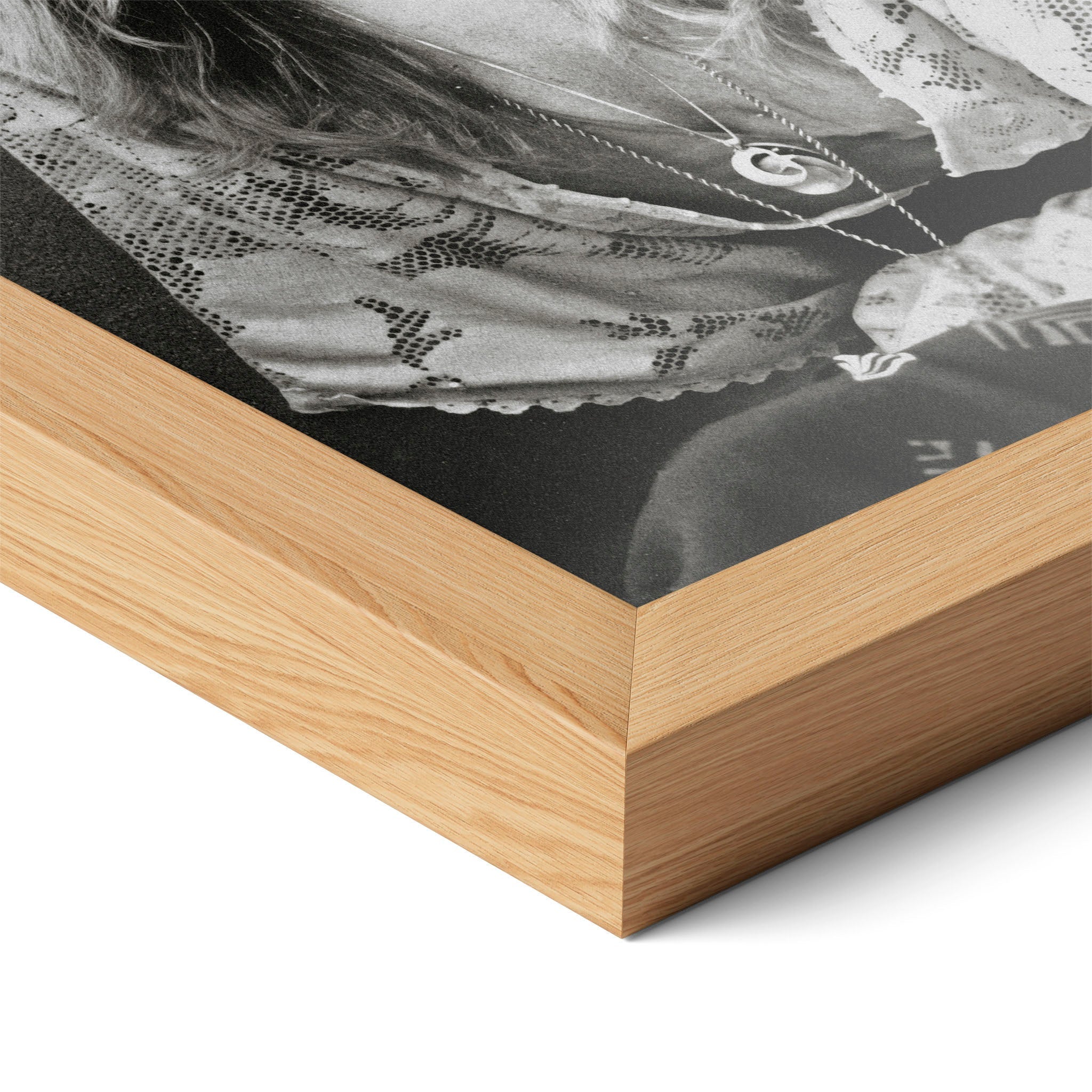 Corner close-up of the Stevie Nicks 1976 black and white portrait in a natural oak frame