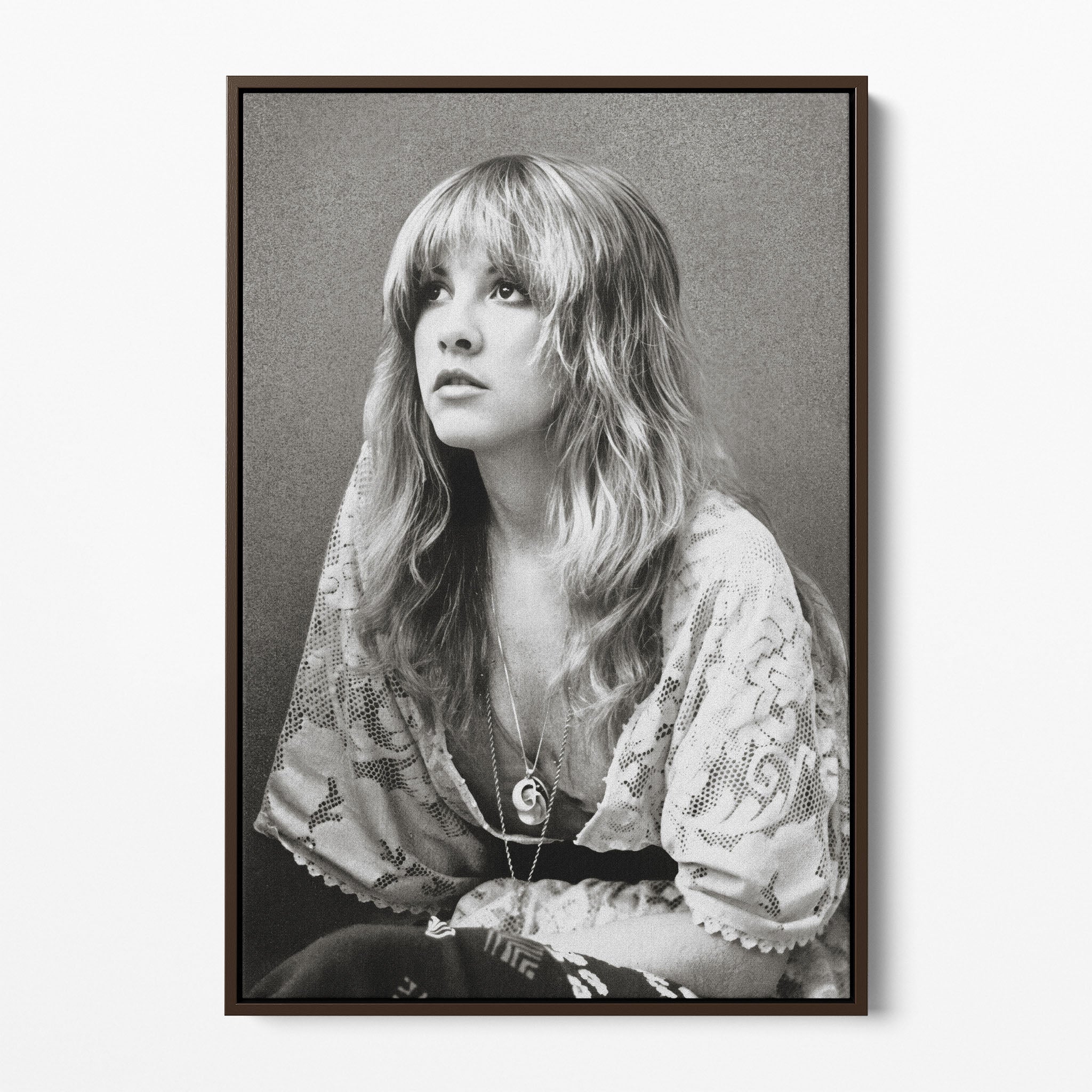 Front view of the Stevie Nicks 1976 black and white portrait canvas in a dark walnut floating frame