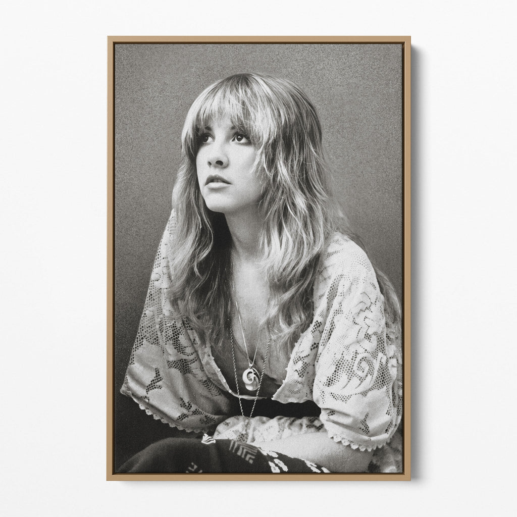 Front view of the Stevie Nicks 1976 black and white portrait canvas in a natural oak floating frame