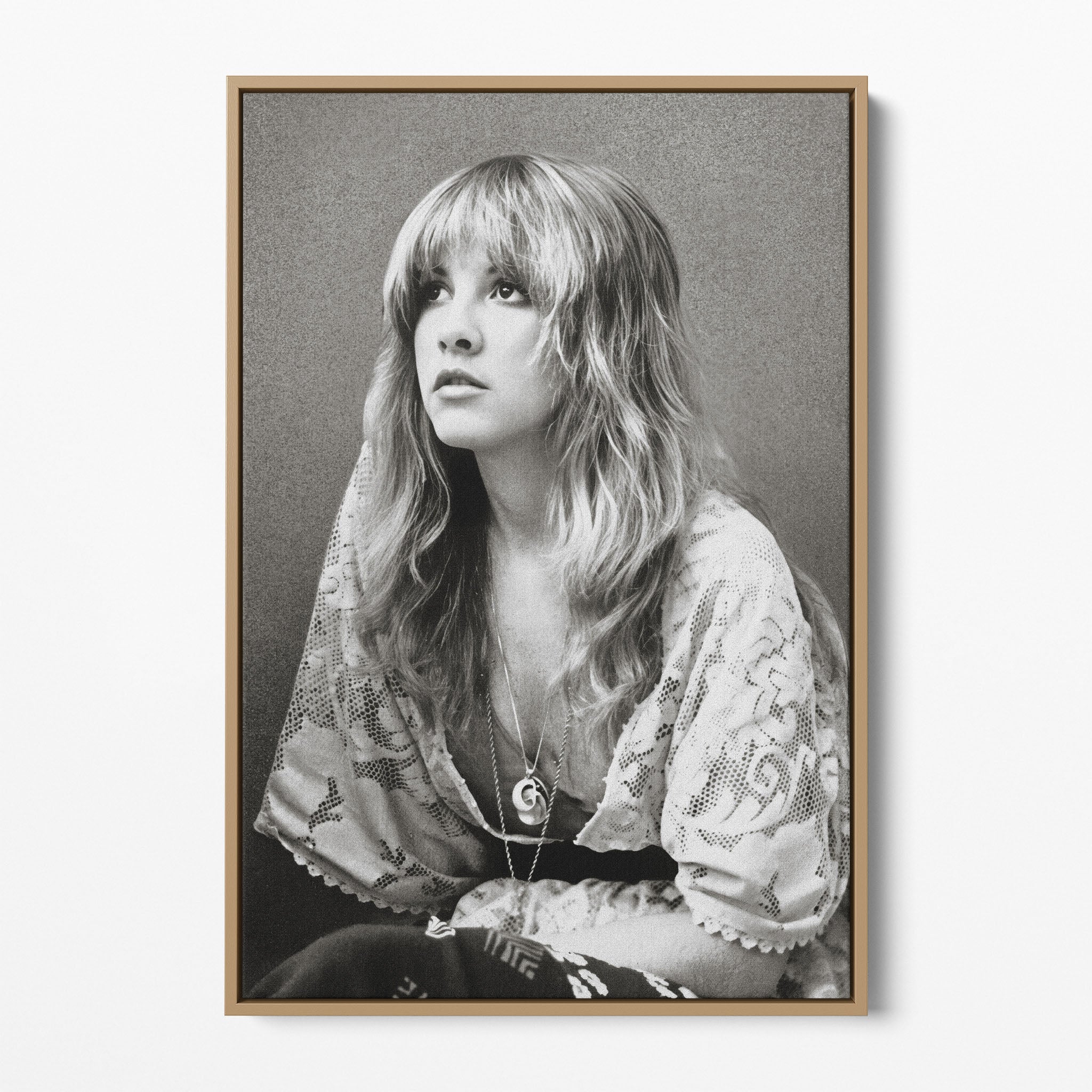 Front view of the Stevie Nicks 1976 black and white portrait canvas in a natural oak floating frame