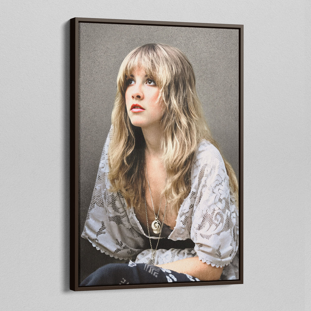 Angled view of the Stevie Nicks 1976 colour portrait canvas in a dark walnut floating frame