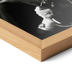 Corner close-up of the Stevie Nicks 1977 Oakland black and white poster in a natural oak frame