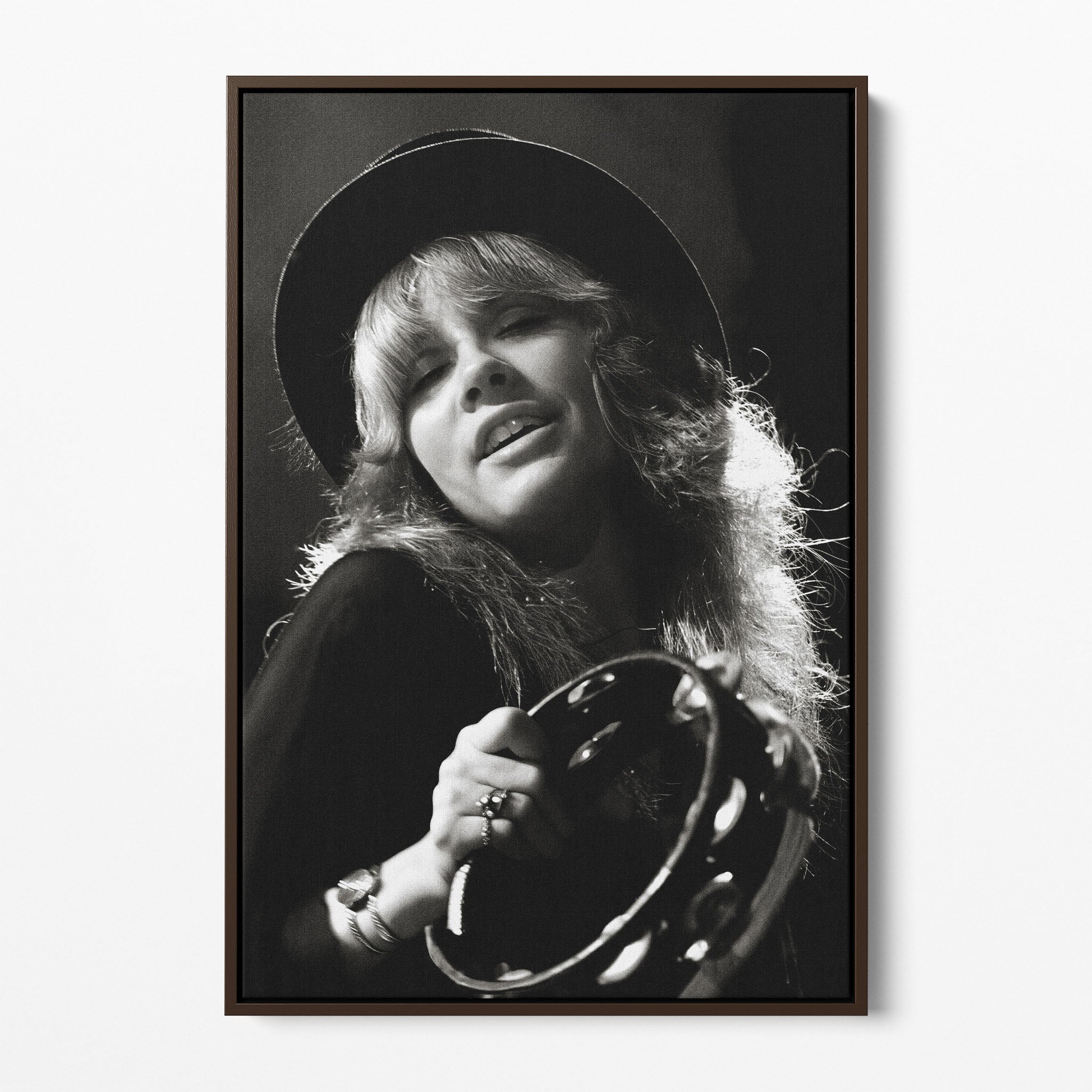 Front view of the Stevie Nicks 1977 Oakland black and white canvas in a dark walnut floating frame