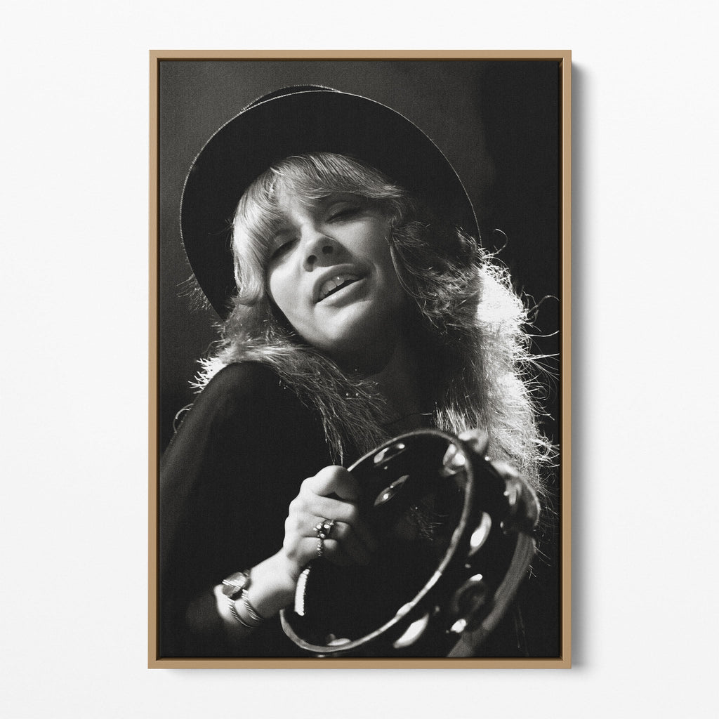 Front view of the Stevie Nicks 1977 Oakland black and white canvas in a natural oak floating frame
