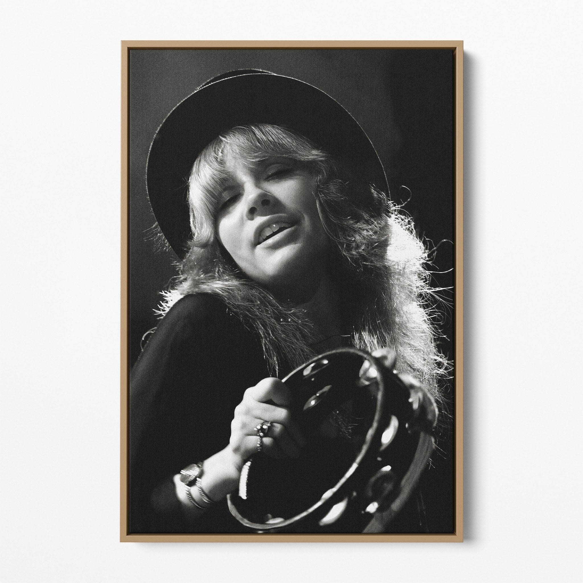 Front view of the Stevie Nicks 1977 Oakland black and white canvas in a natural oak floating frame