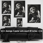 Wall art size comparison chart displaying multiple print dimensions above an average 3-seater sofa