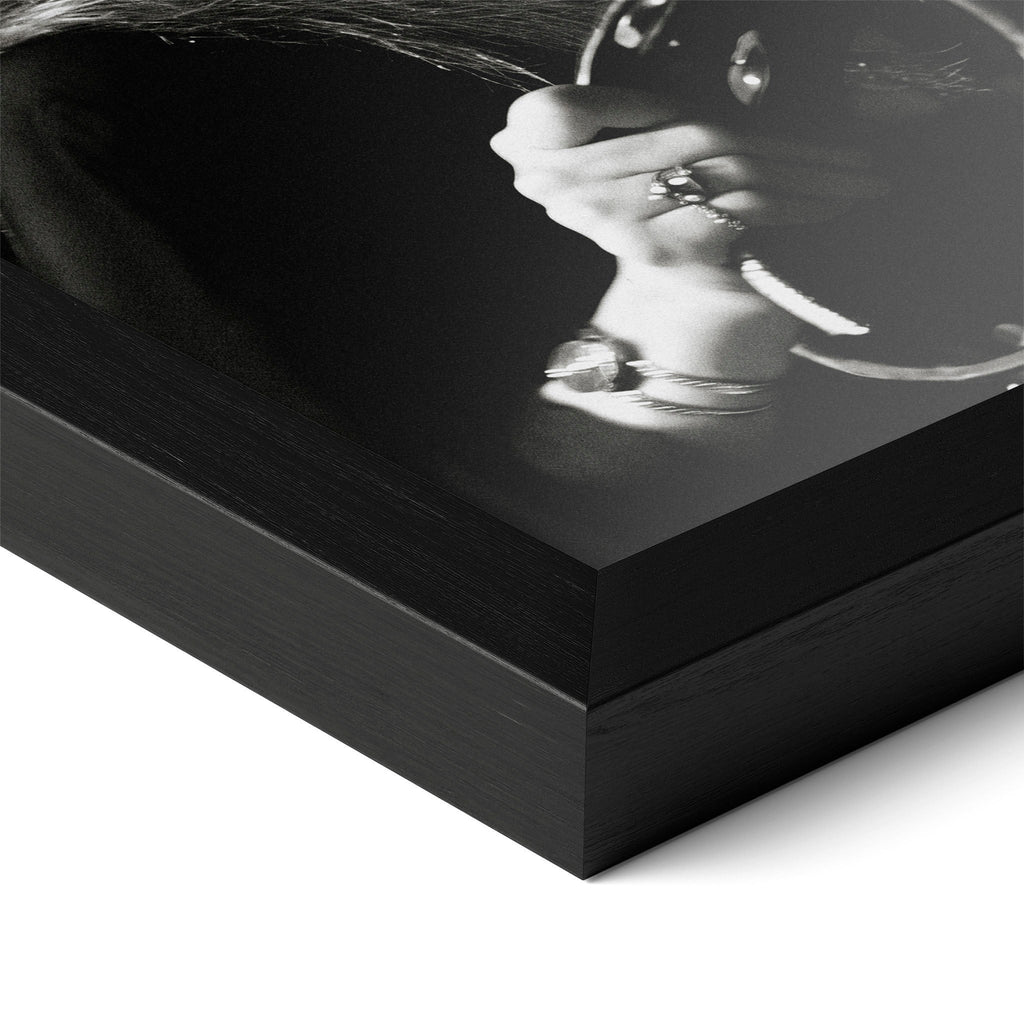 Corner close-up of the Stevie Nicks 1977 Oakland black and white poster in a classic black frame