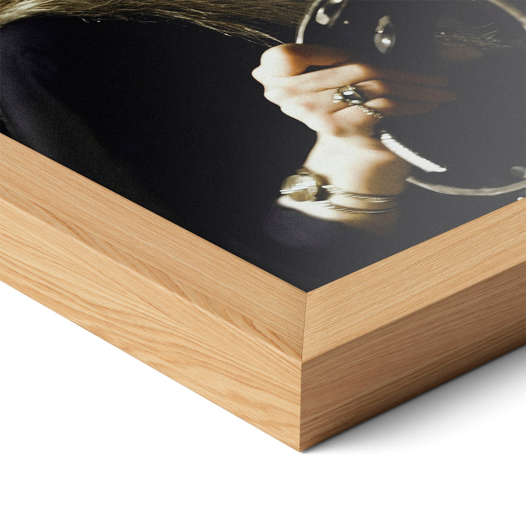 Corner close-up of the Stevie Nicks 1977 Oakland colour poster in a natural oak frame