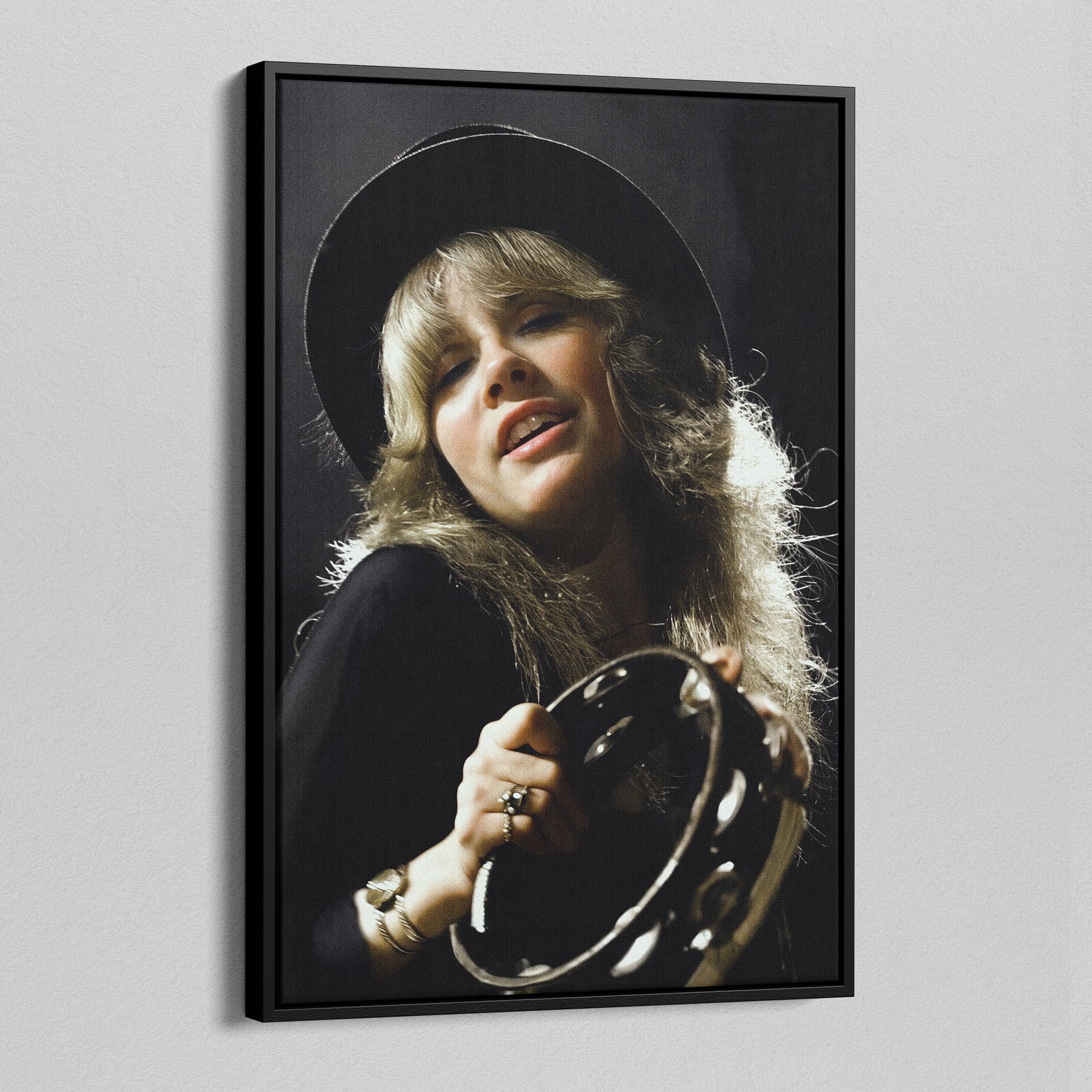 Angled view of the Stevie Nicks 1977 Oakland colour canvas in a black floating frame