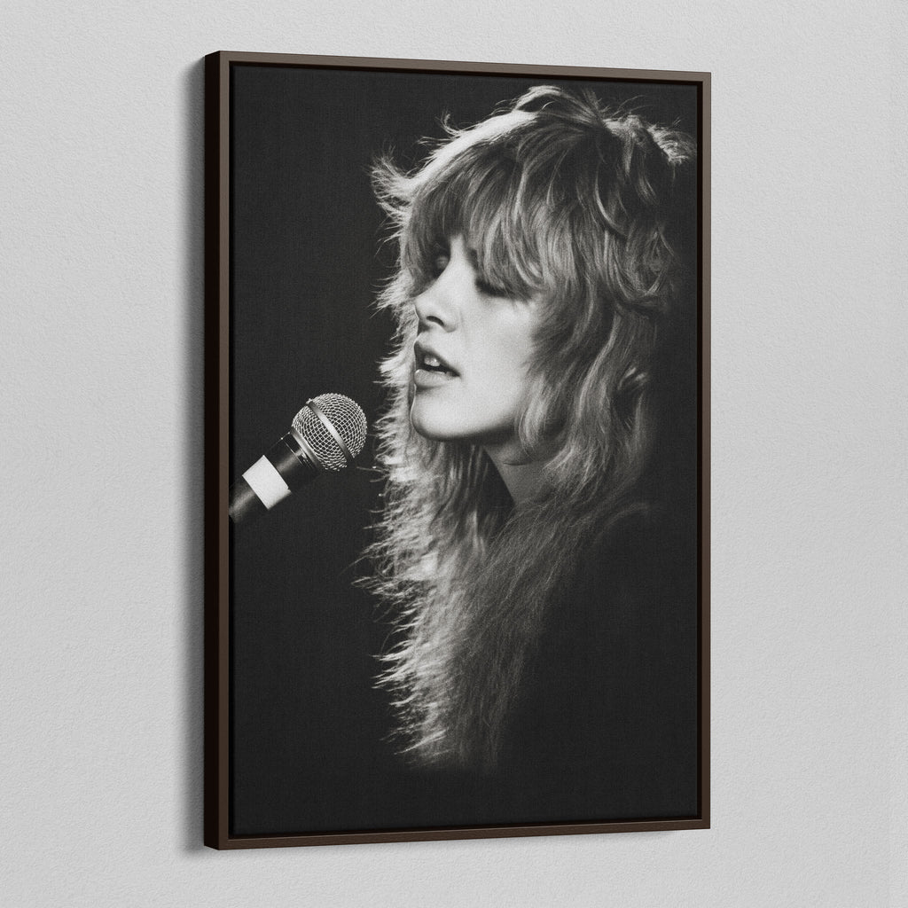 Angled view of the Stevie Nicks Rumours era black and white canvas in a dark walnut floating frame