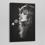 Angled view of the Stevie Nicks Rumours era black and white canvas in a dark walnut floating frame