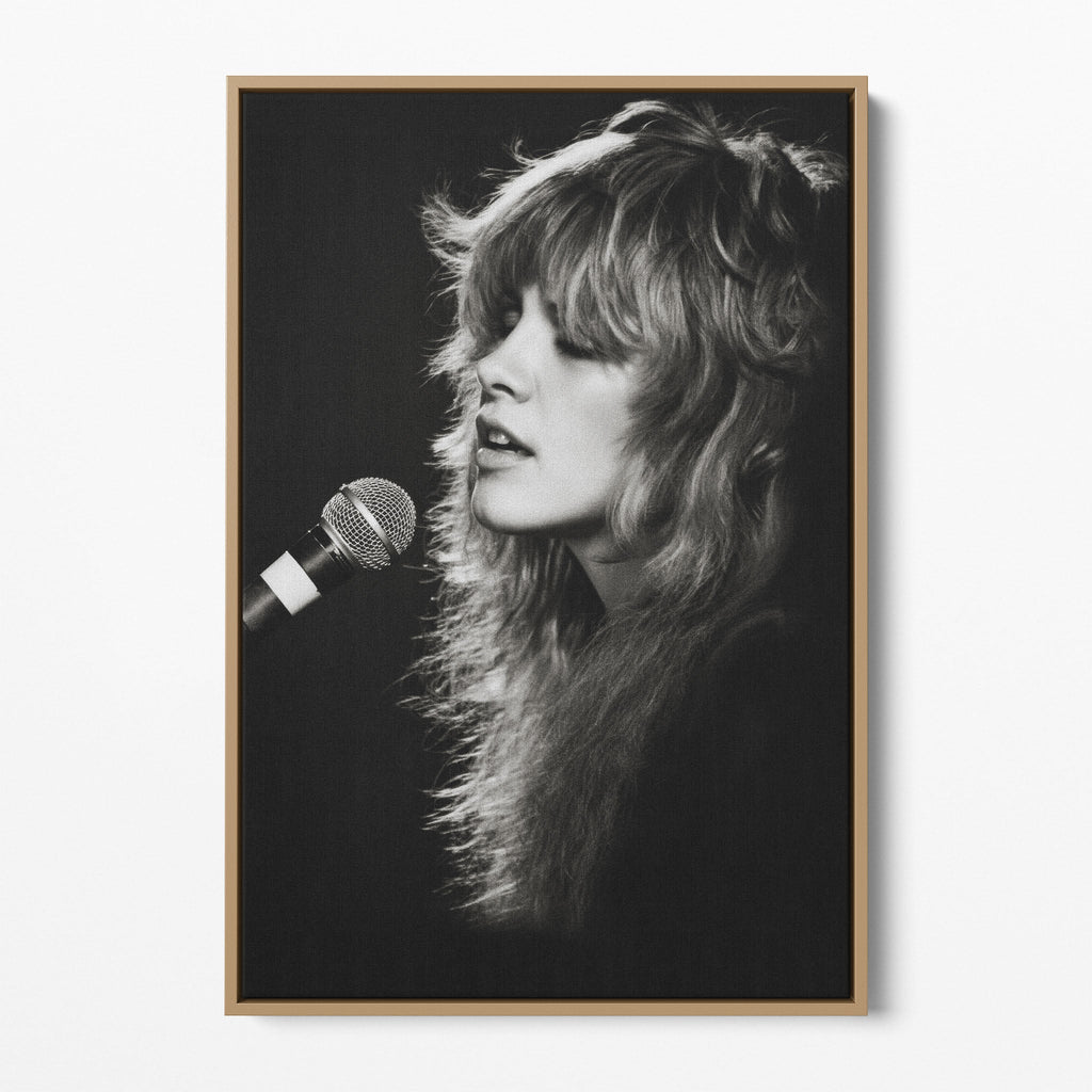 Front view of the Stevie Nicks Rumours era black and white canvas in a natural oak floating frame