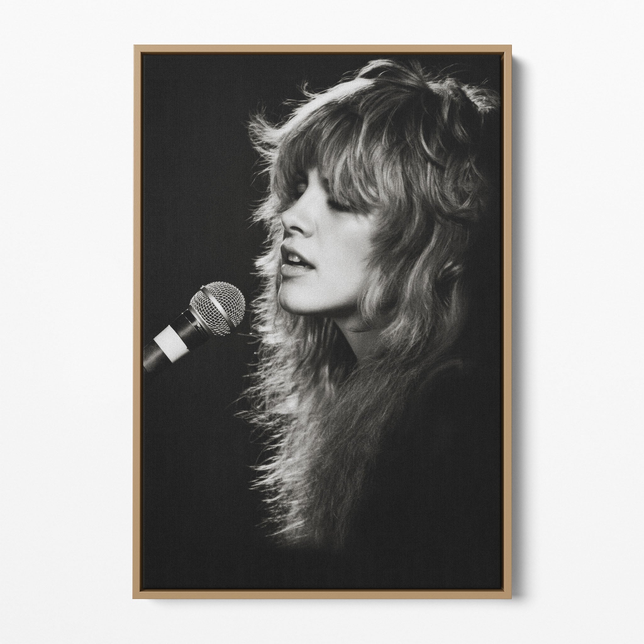 Front view of the Stevie Nicks Rumours era black and white canvas in a natural oak floating frame