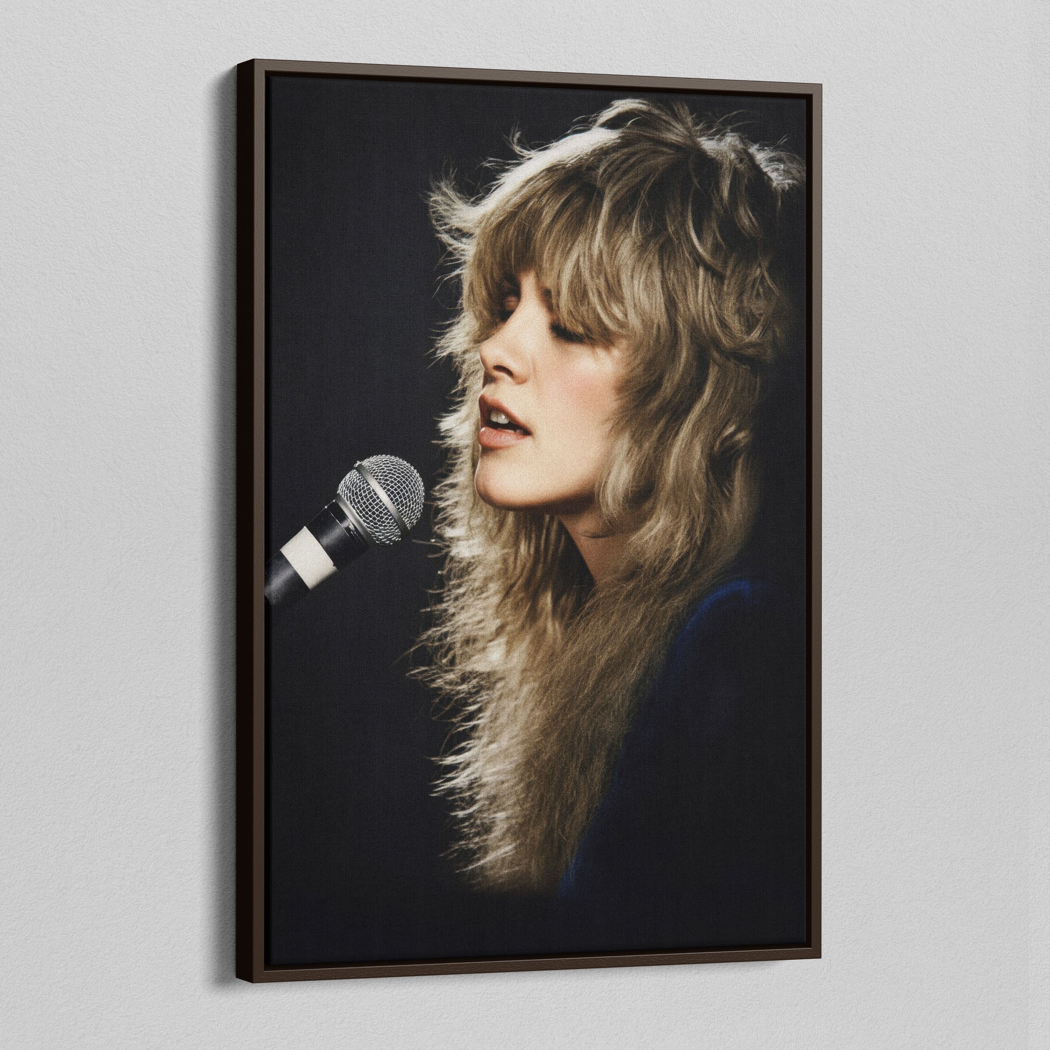 Angled view of the Stevie Nicks Rumours era colorized canvas in a dark walnut floating frame