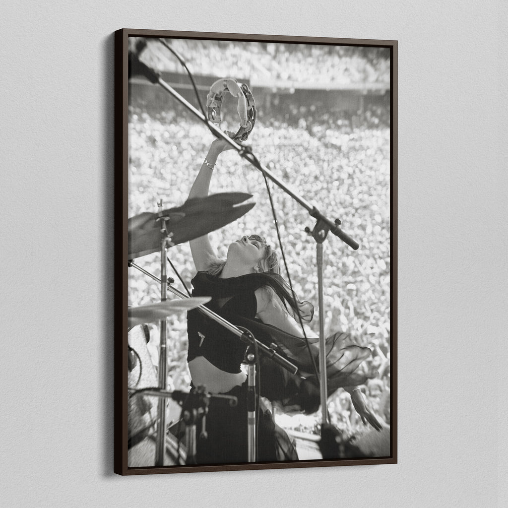 Angled view of the Stevie Nicks 1976 Oakland black and white canvas in a dark walnut floating frame