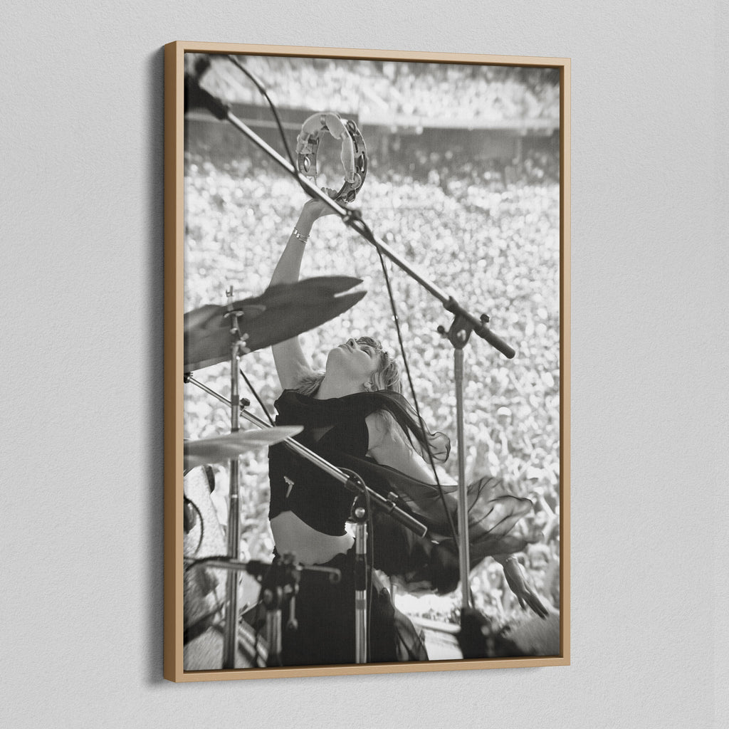 Angled view of the Stevie Nicks 1976 Oakland black and white canvas in a natural oak floating frame