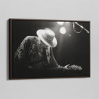 Angled view of the Stevie Ray Vaughan 1985 Laramie black and white canvas in a dark walnut floating frame