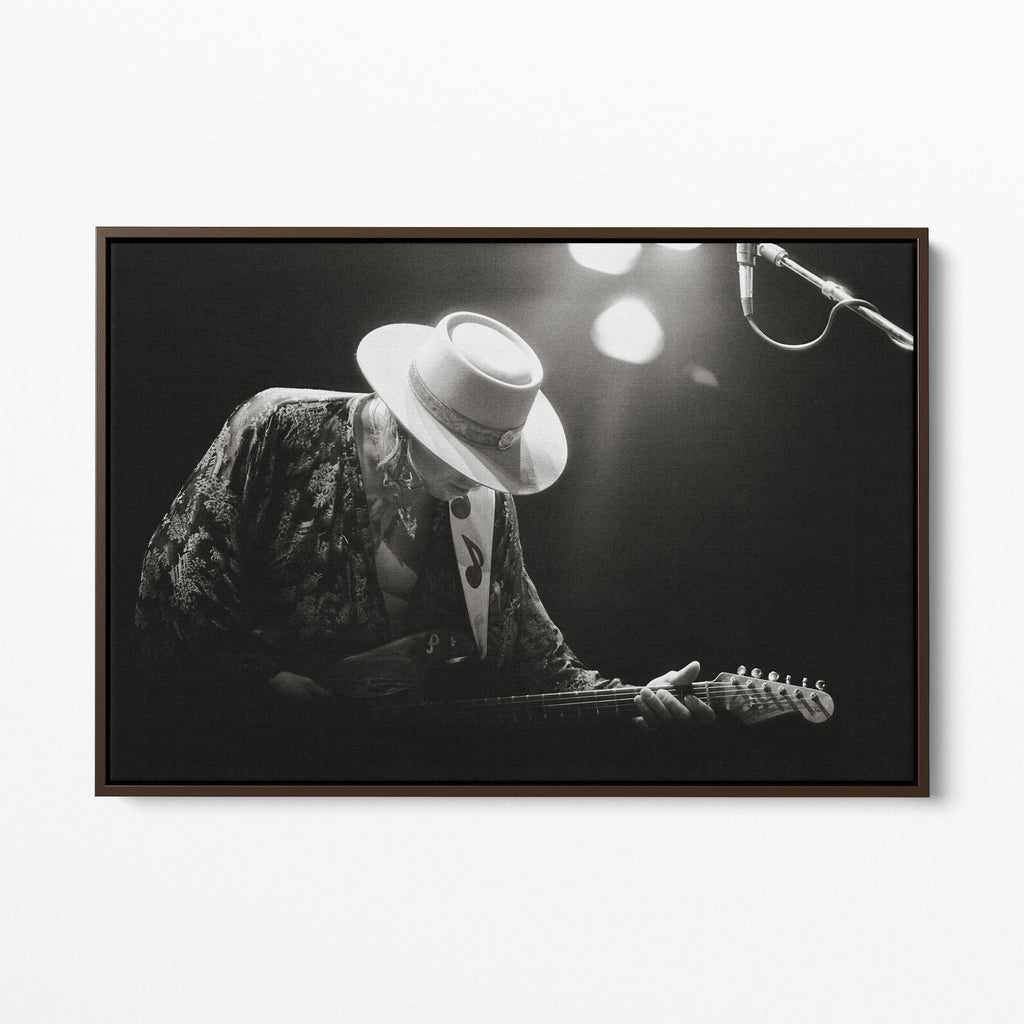 Front view of the Stevie Ray Vaughan 1985 Laramie black and white canvas in a dark walnut floating frame