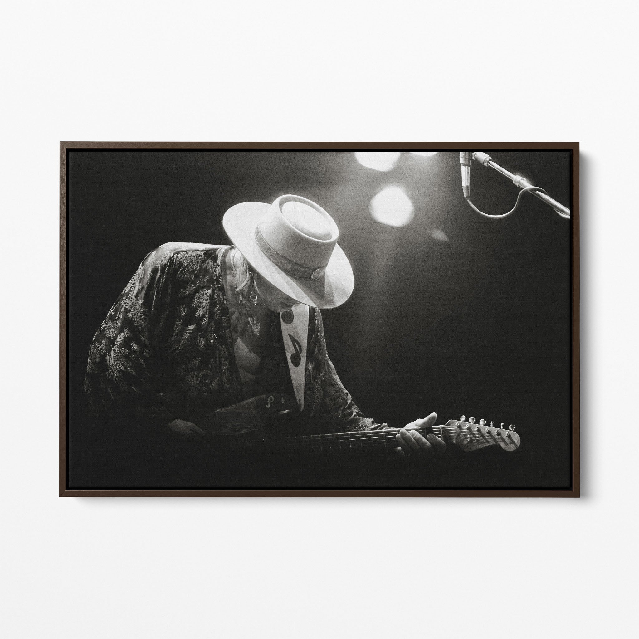 Front view of the Stevie Ray Vaughan 1985 Laramie black and white canvas in a dark walnut floating frame