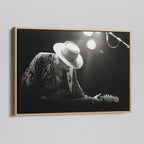 Angled view of the Stevie Ray Vaughan 1985 Laramie black and white canvas in a natural oak floating frame