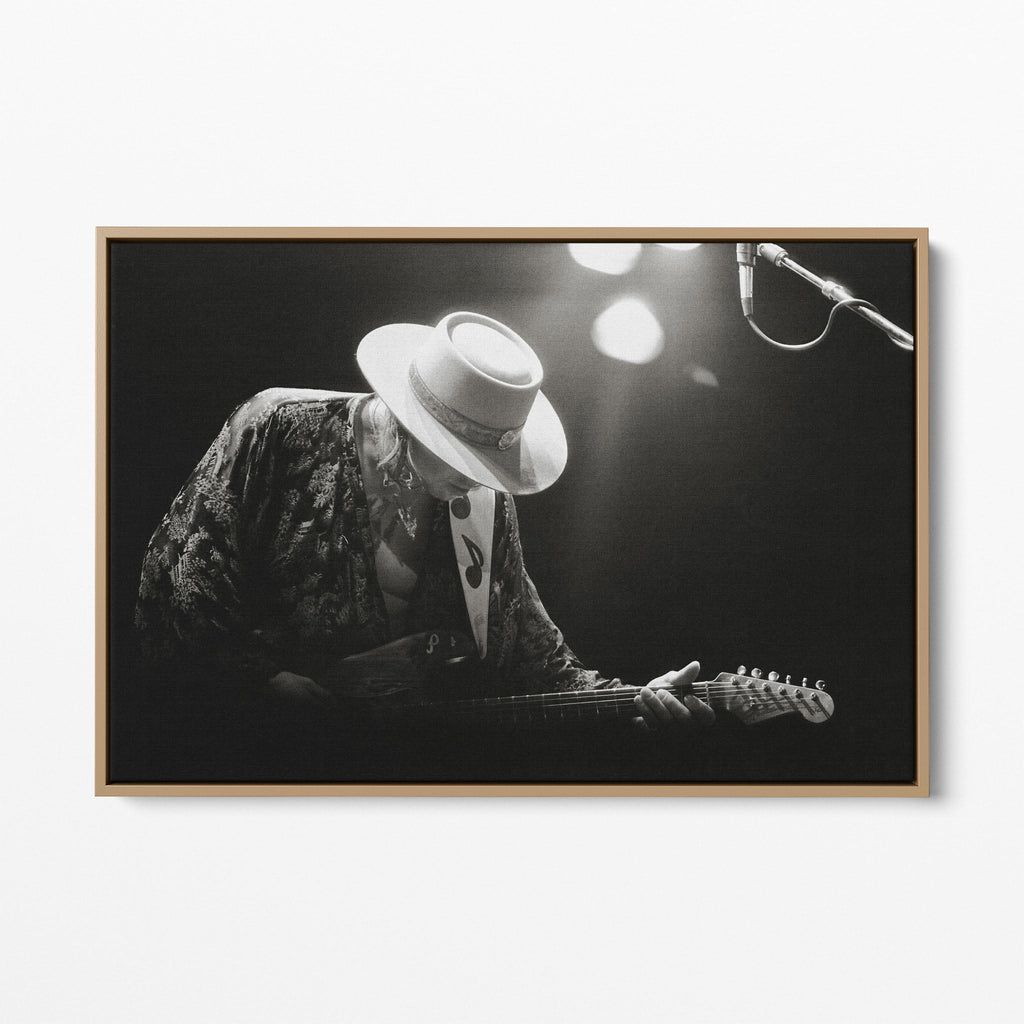 Front view of the Stevie Ray Vaughan 1985 Laramie black and white canvas in a natural oak floating frame