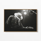 Front view of the Stevie Ray Vaughan 1985 Laramie black and white canvas in a natural oak floating frame