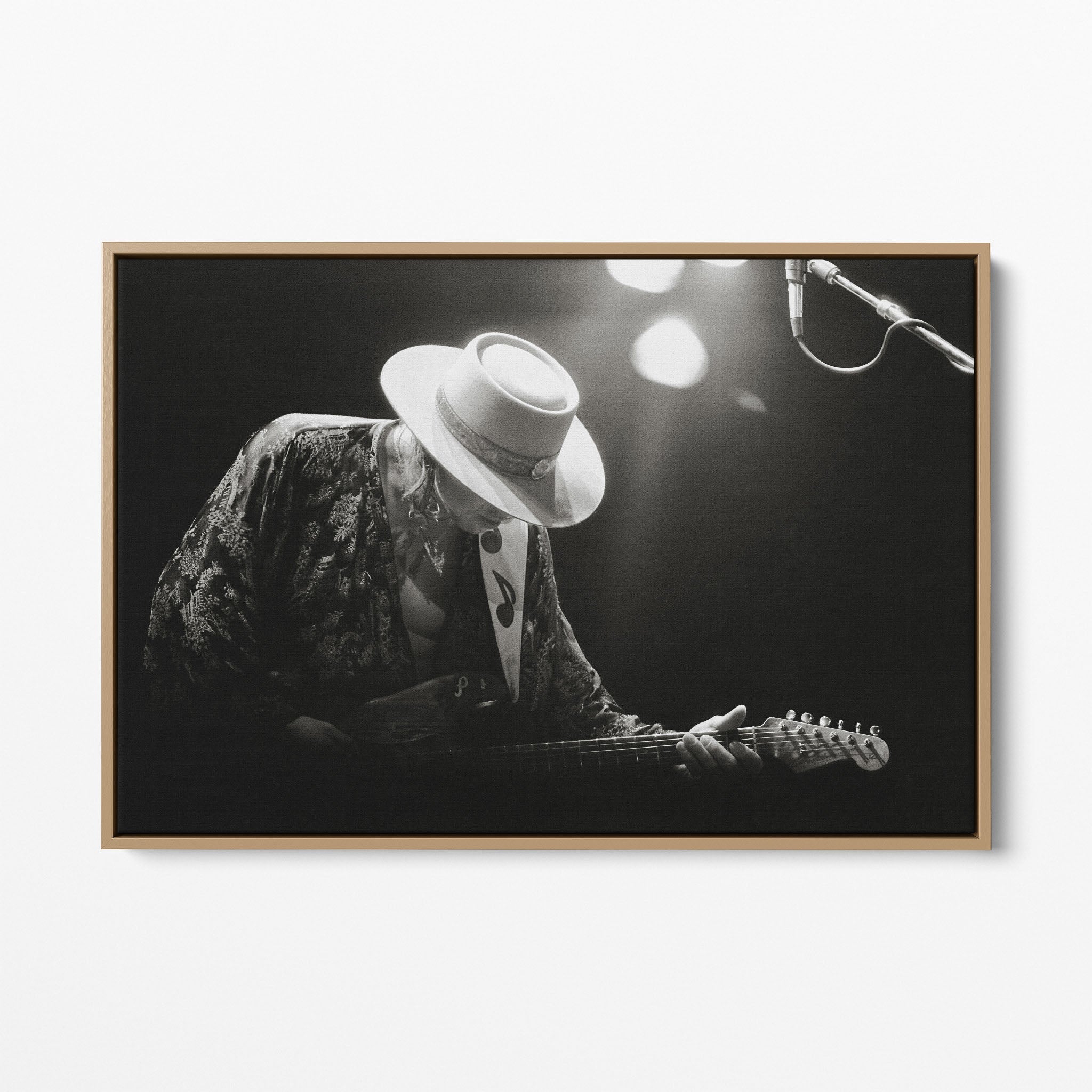 Front view of the Stevie Ray Vaughan 1985 Laramie black and white canvas in a natural oak floating frame