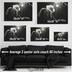 Wall art size comparison chart displaying multiple print dimensions above an average 3-seater sofa