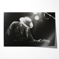 Stevie Ray Vaughan 1985 Soul to Soul Tour black and white concert portrait with Fender Stratocaster and wide-brimmed hat, unframed poster preview