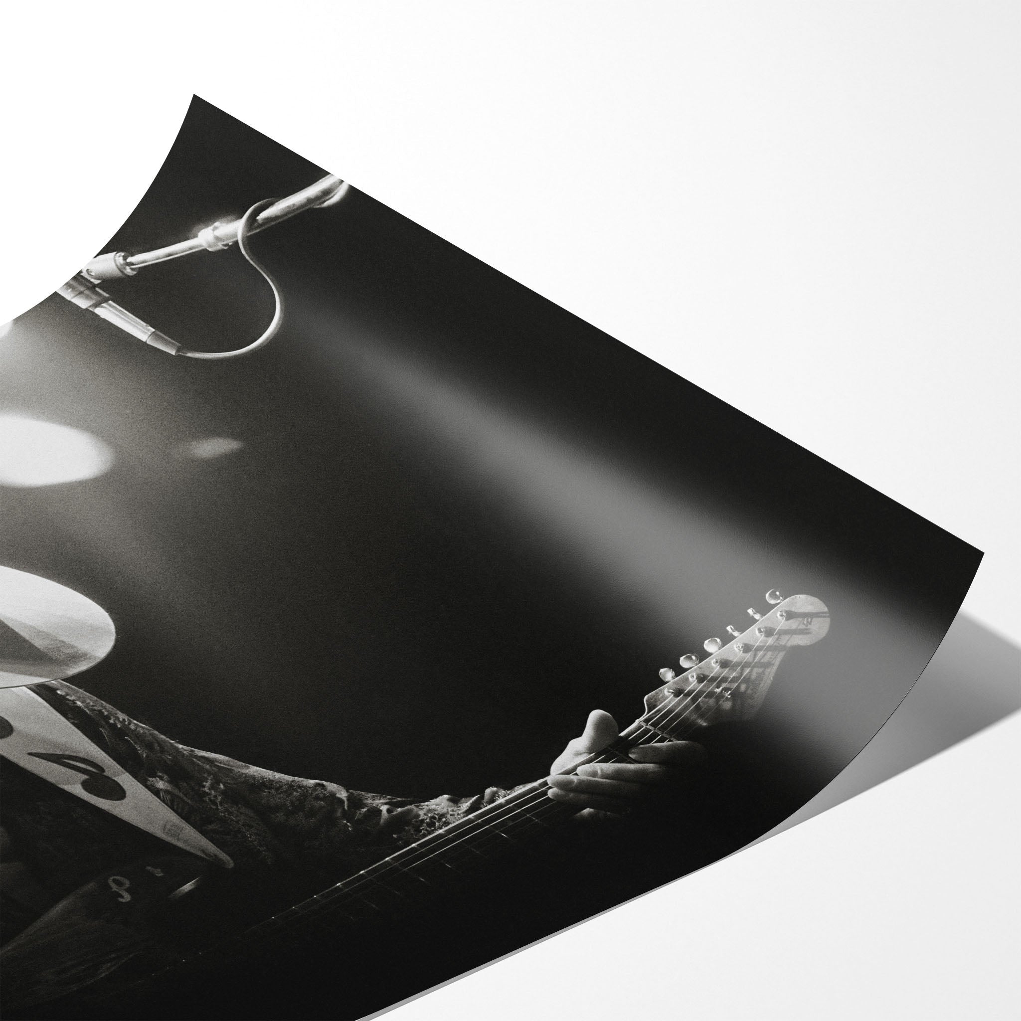 Angled close-up of the unframed Stevie Ray Vaughan 1985 Laramie black and white concert poster showing paper detail