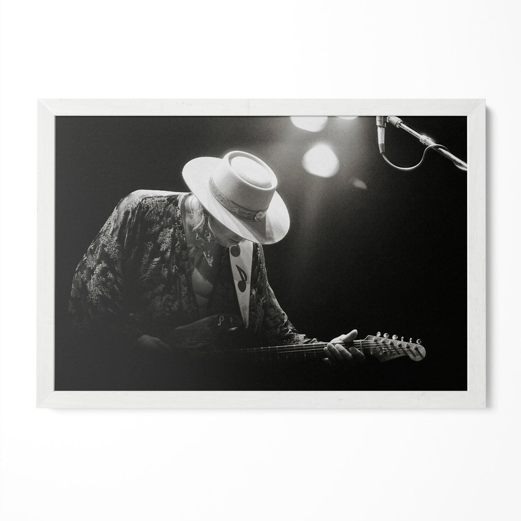 Stevie Ray Vaughan 1985 Laramie Wyoming black and white blues concert portrait in a classic white poster frame