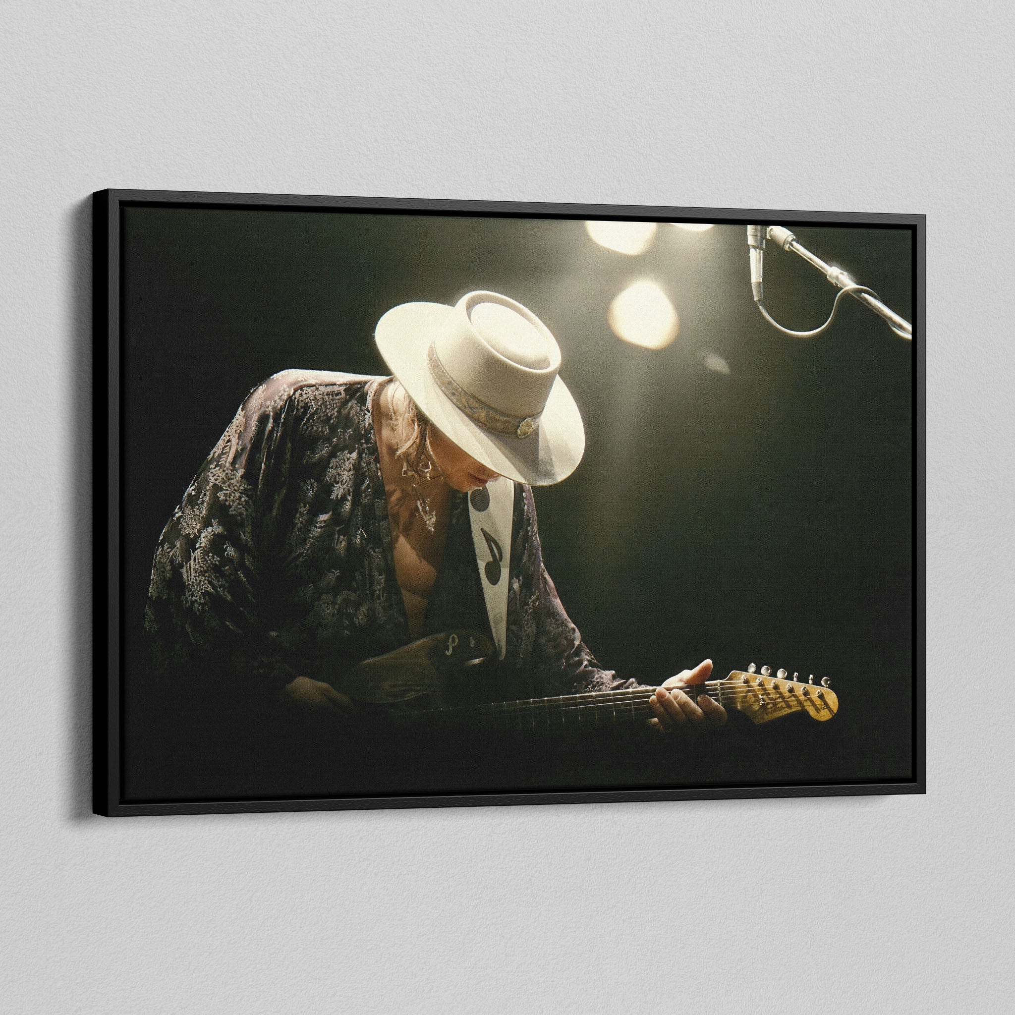 Angled view of the Stevie Ray Vaughan 1985 Laramie colorized canvas in a black floating frame