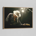 Angled view of the Stevie Ray Vaughan 1985 Laramie colorized canvas in a natural oak floating frame