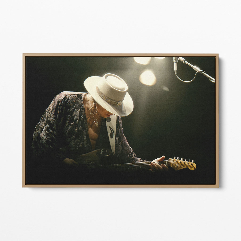 Front view of the Stevie Ray Vaughan 1985 Laramie colorized canvas in a natural oak floating frame