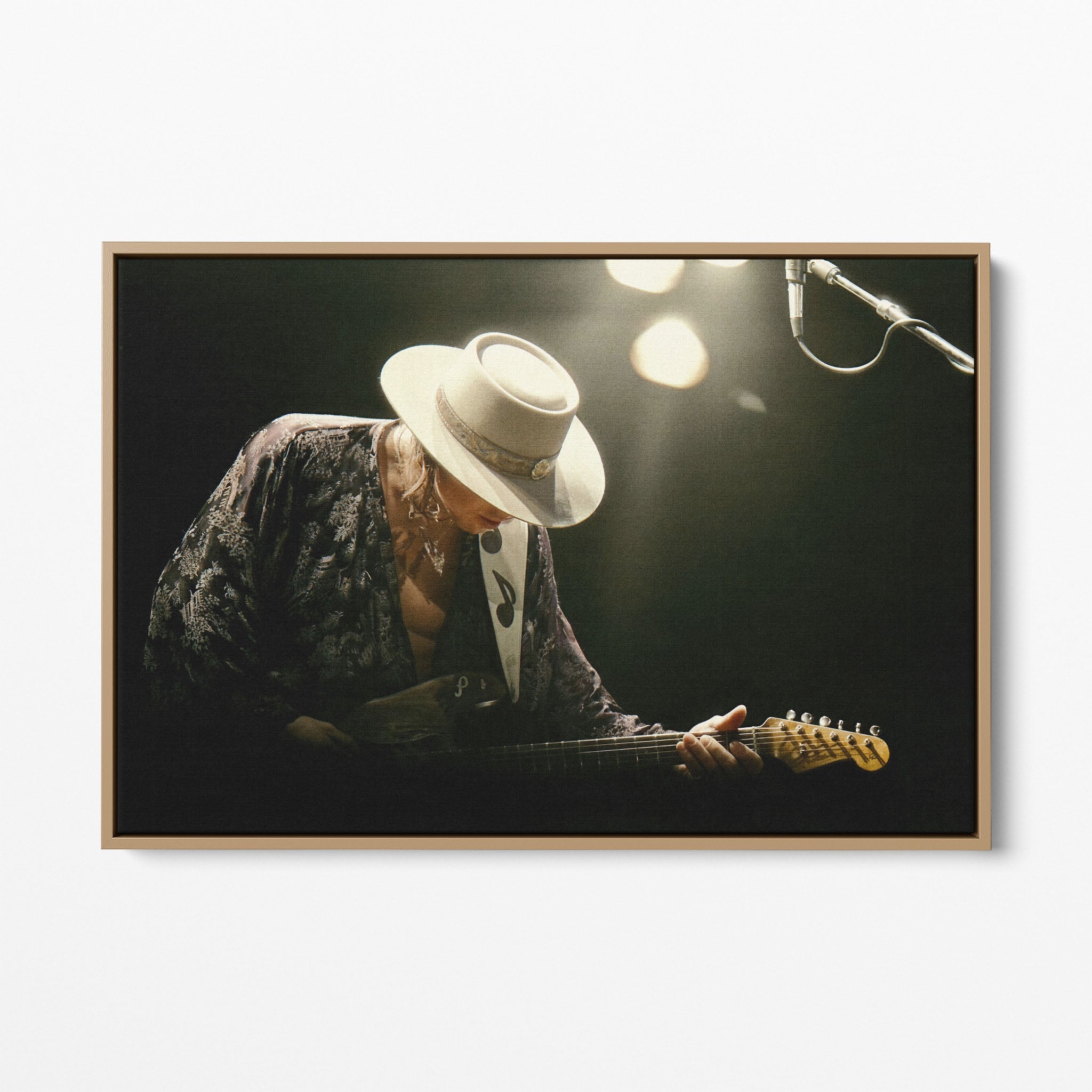 Front view of the Stevie Ray Vaughan 1985 Laramie colorized canvas in a natural oak floating frame
