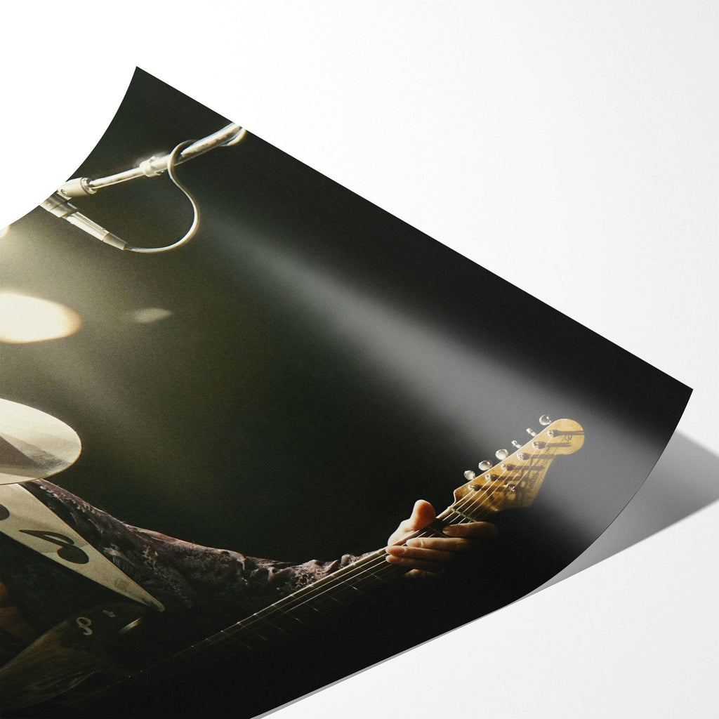 Angled close-up of the unframed Stevie Ray Vaughan 1985 Laramie colorized concert poster showing paper detail