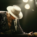 Medium zoom highlighting the crisp detail and vivid colour of the Stevie Ray Vaughan 1985 Laramie print