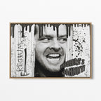 Front view of the Shining Here's Johnny black and white canvas in a natural oak floating frame
