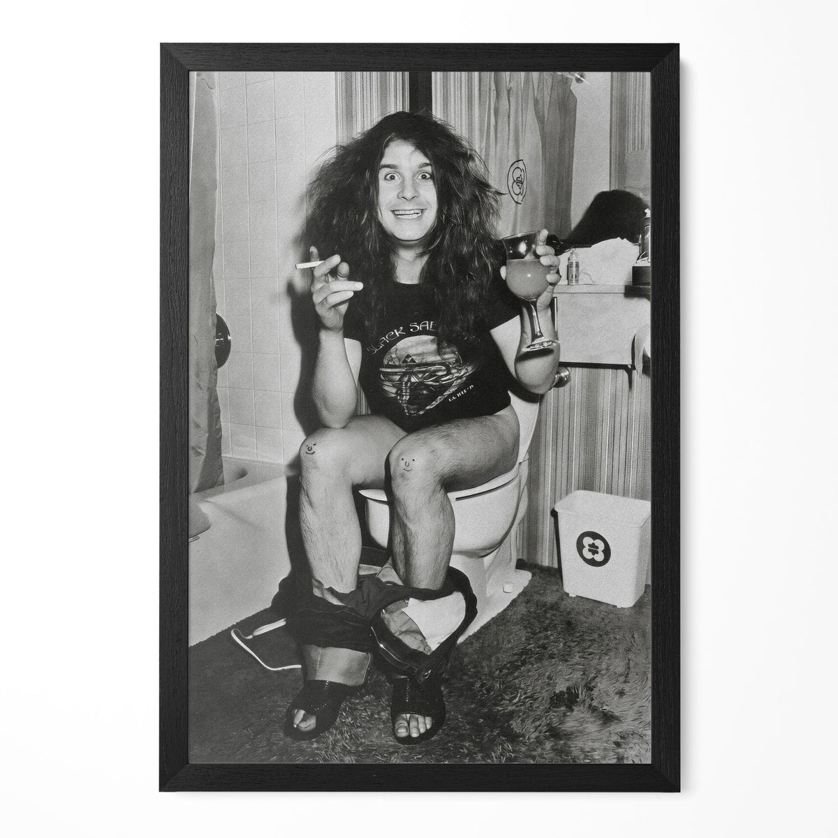 Funny black and white photo of a heavy metal legend on the toilet in 1978, in a classic black poster frame