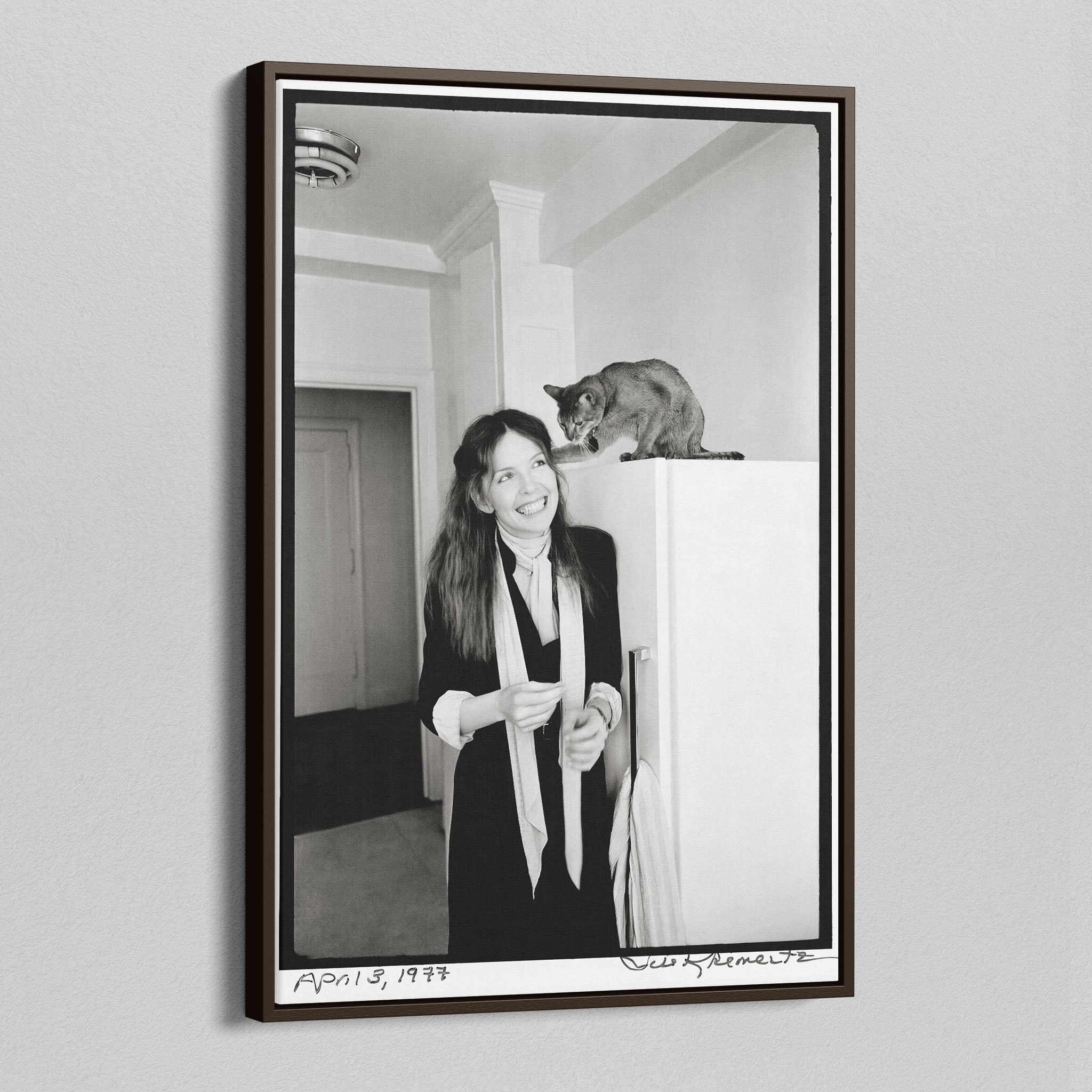Angled view of the Diane Keaton black and white canvas in a dark walnut floating frame