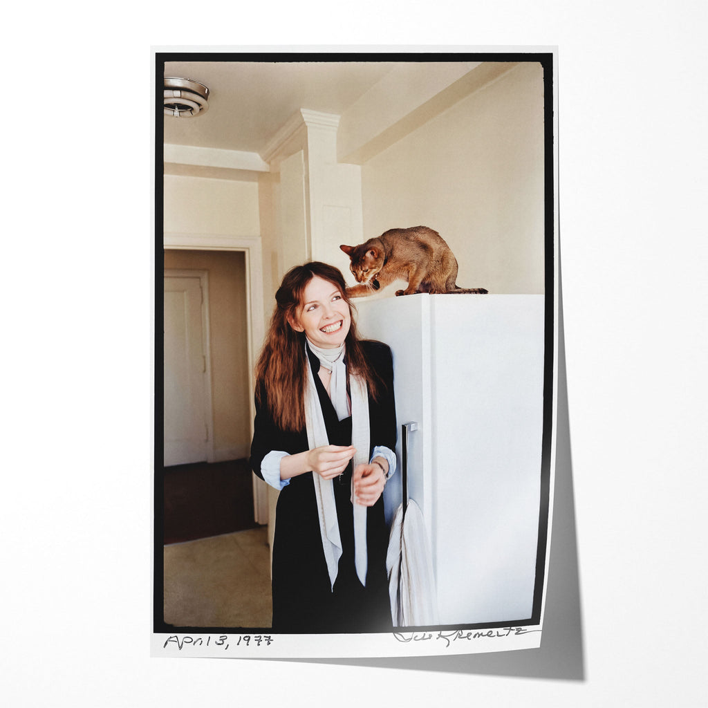 Unframed colour print of Diane Keaton laughing with her Abyssinian cat in her 1977 San Remo apartment