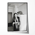 Unframed black and white print of Diane Keaton laughing with her Abyssinian cat in her 1977 San Remo apartment