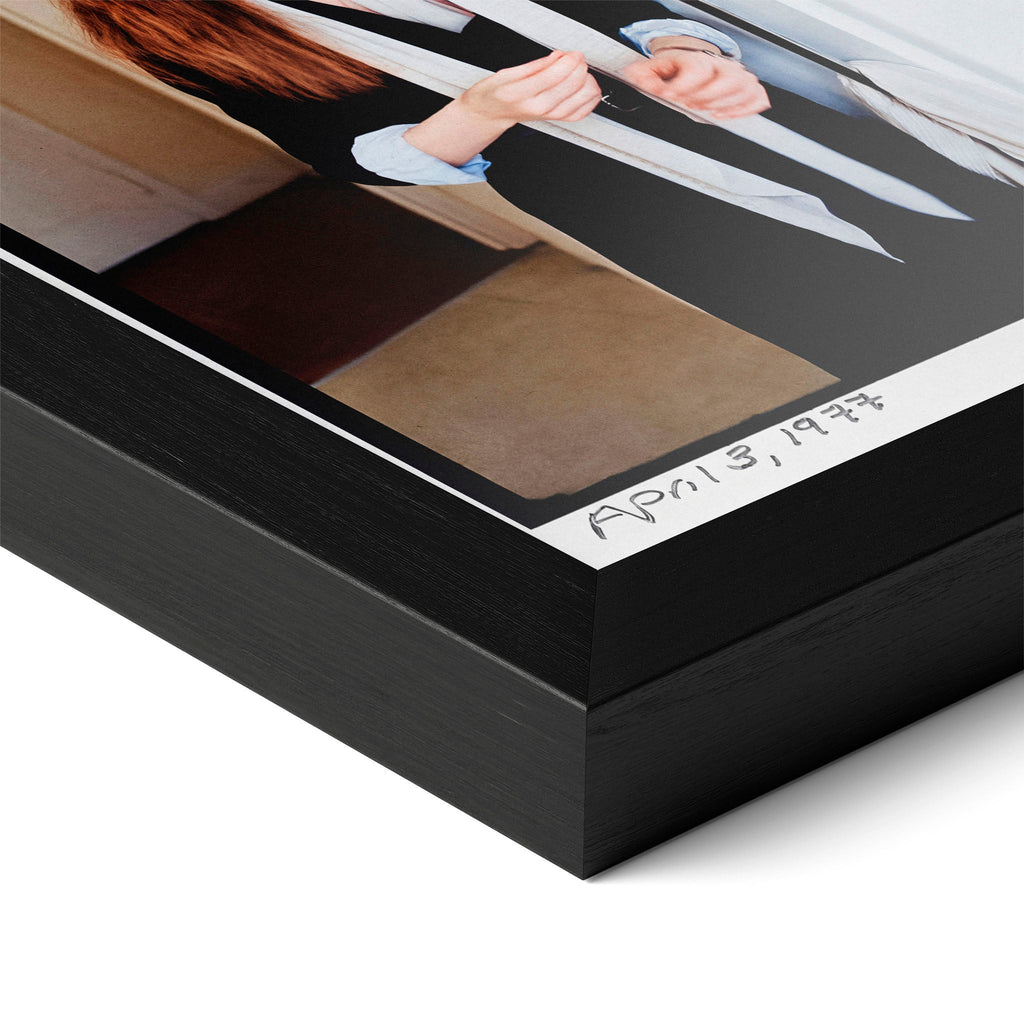 Close-up of the Diane Keaton colour poster in a classic black wood frame