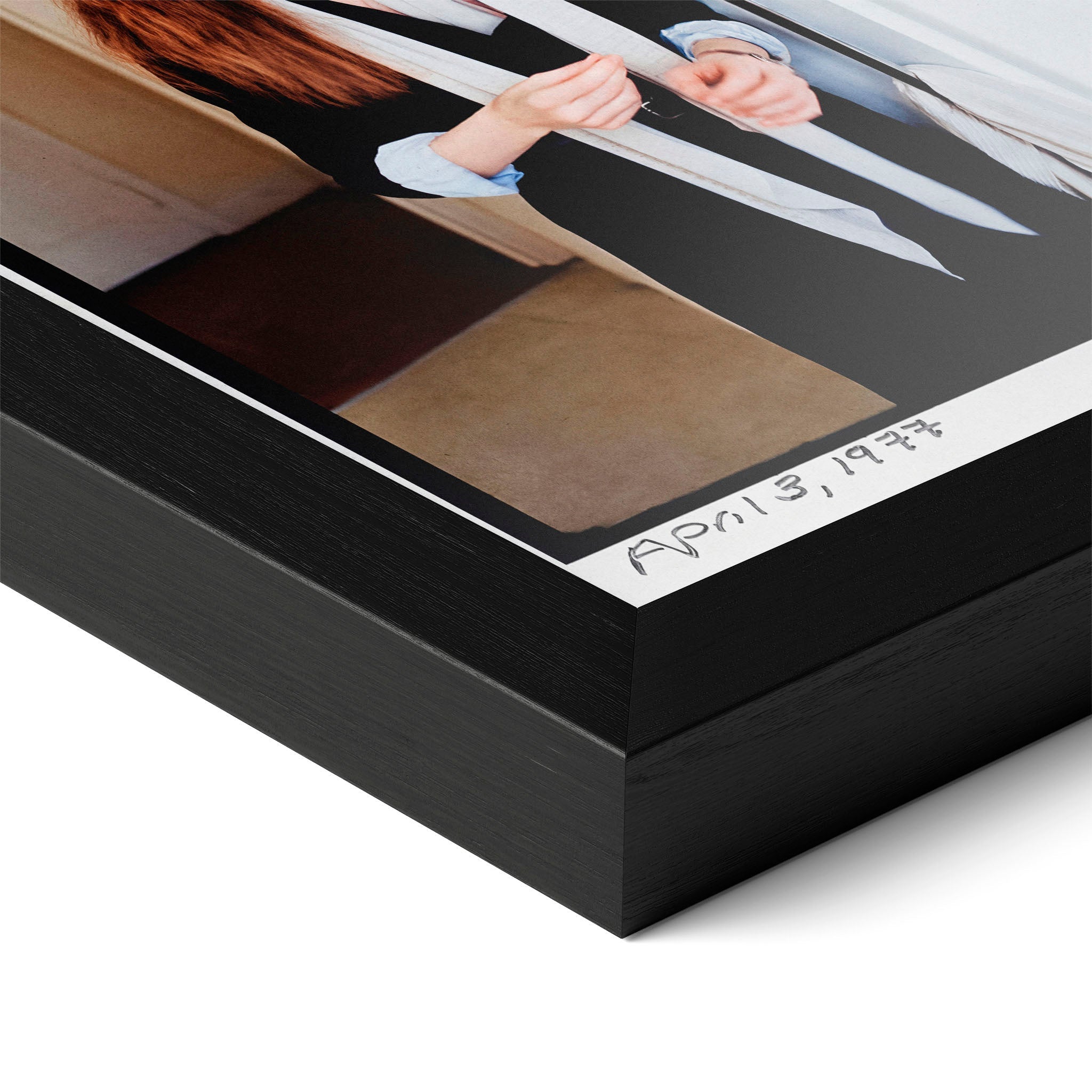 Close-up of the Diane Keaton colour poster in a classic black wood frame